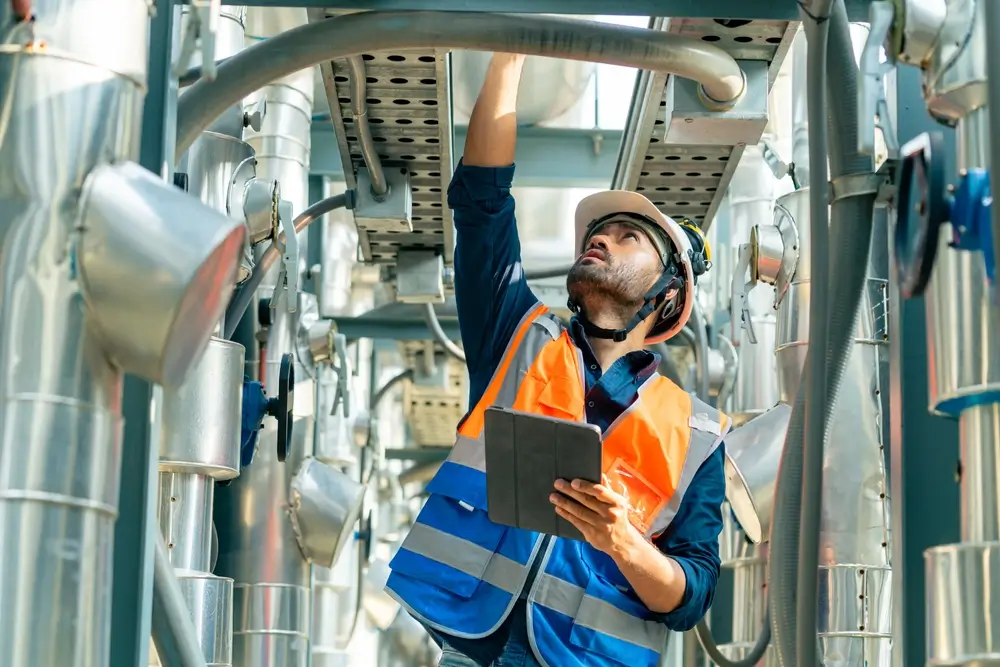 Safety officer conducting workplace audit inspection with checklist